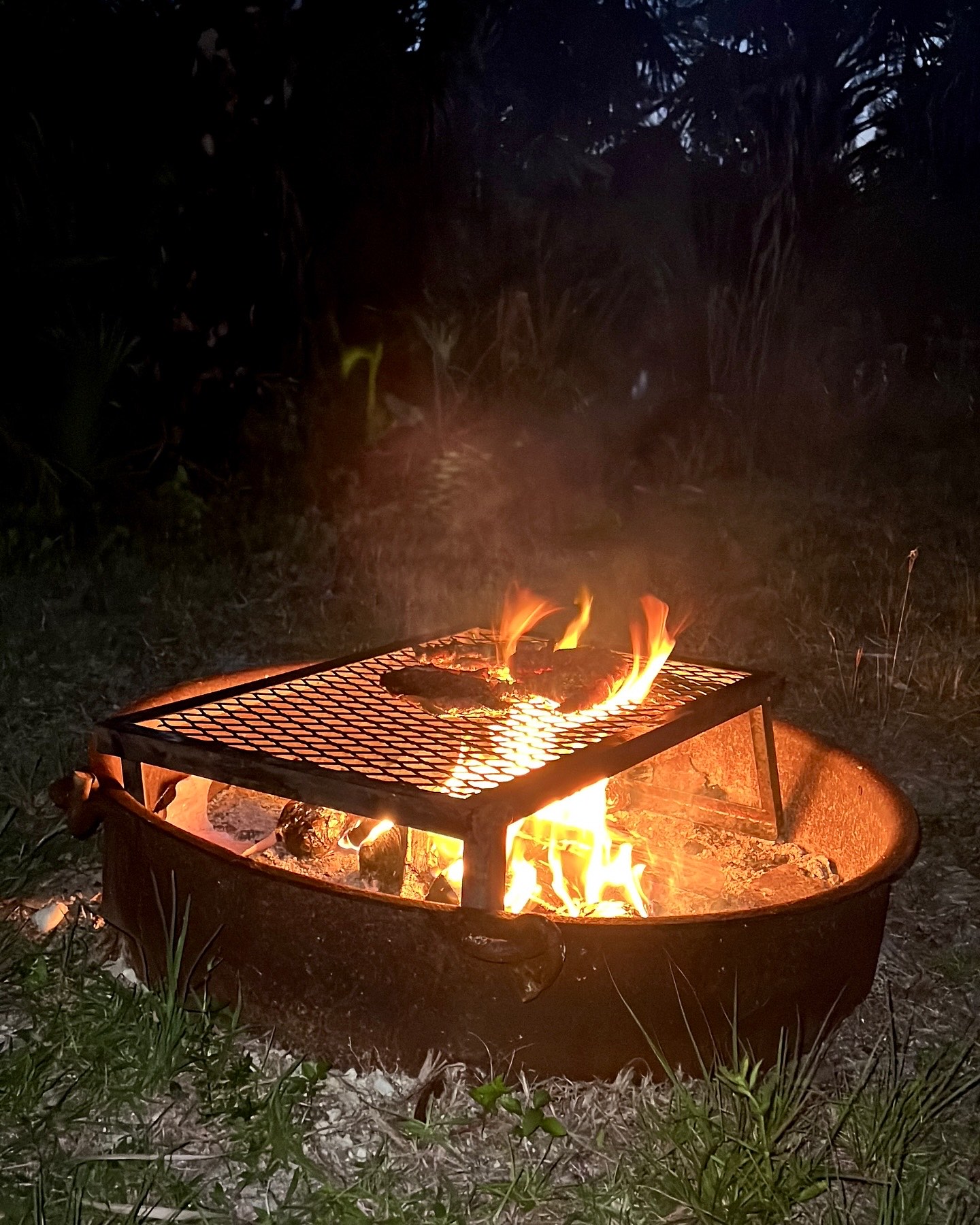 Camp chairs arranged in a ring at a Florida campsite